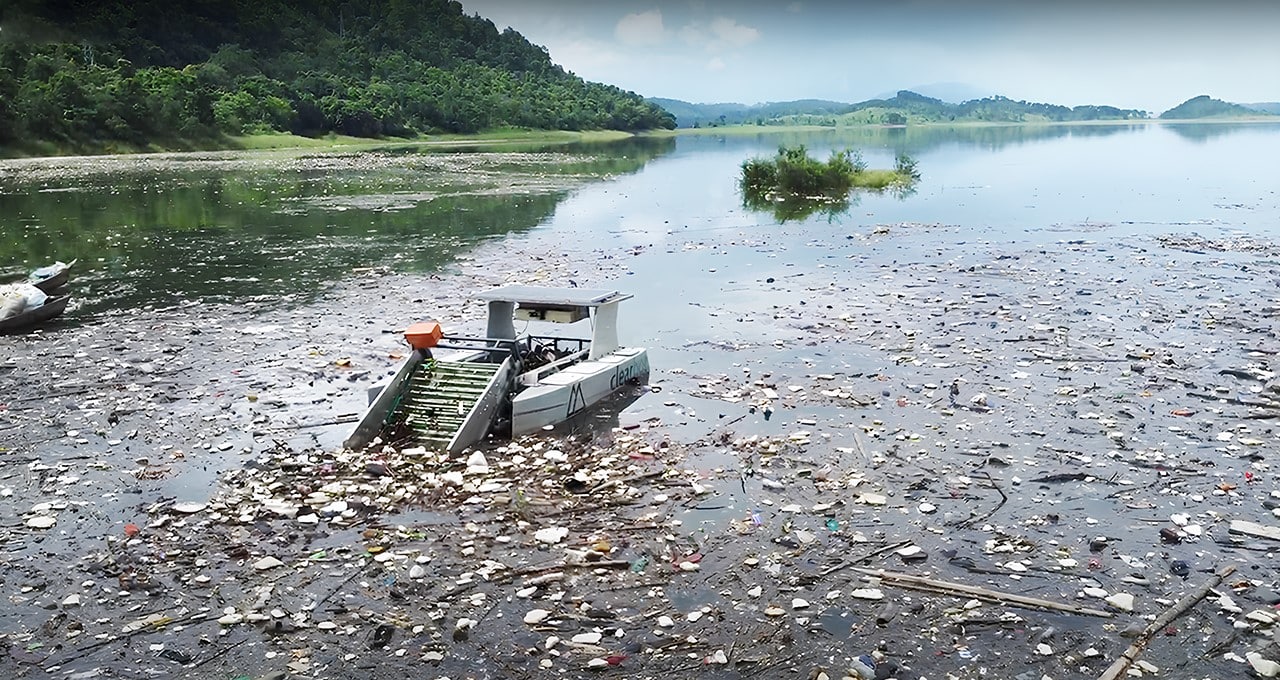 Autonomous waste-collecting boat operating on a debris-covered lake